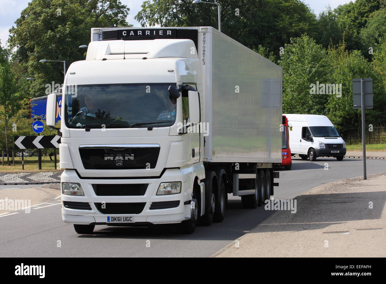 A truck leaving a roundabout in Coulsdon, Surrey, England Stock Photo