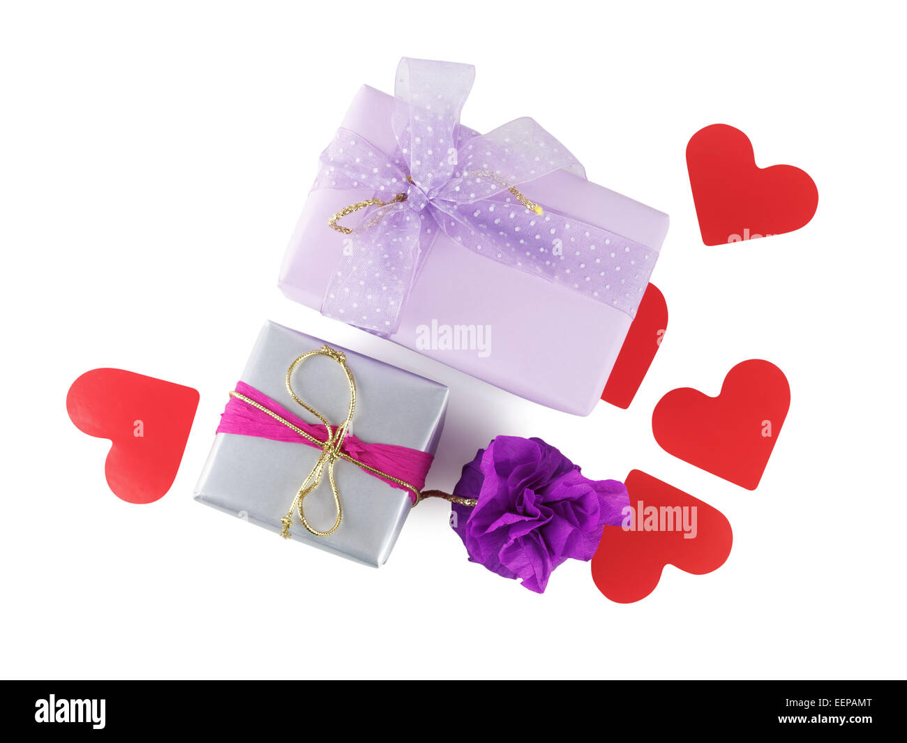 Bright multi-colored gift boxes with paper hearts on a white background ...