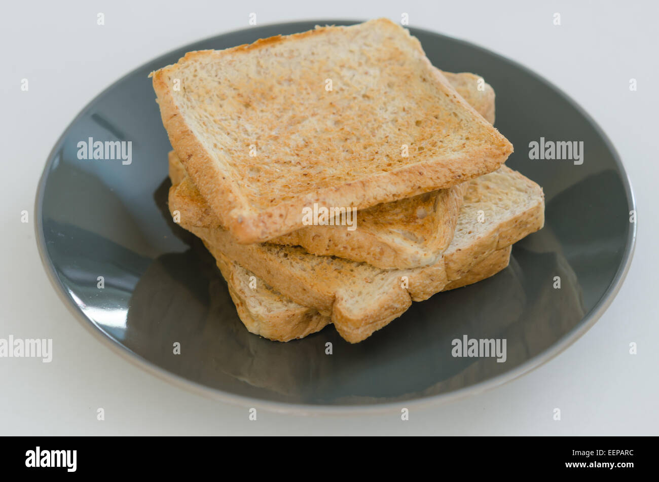 close up of slice toast bread on black dish Stock Photo