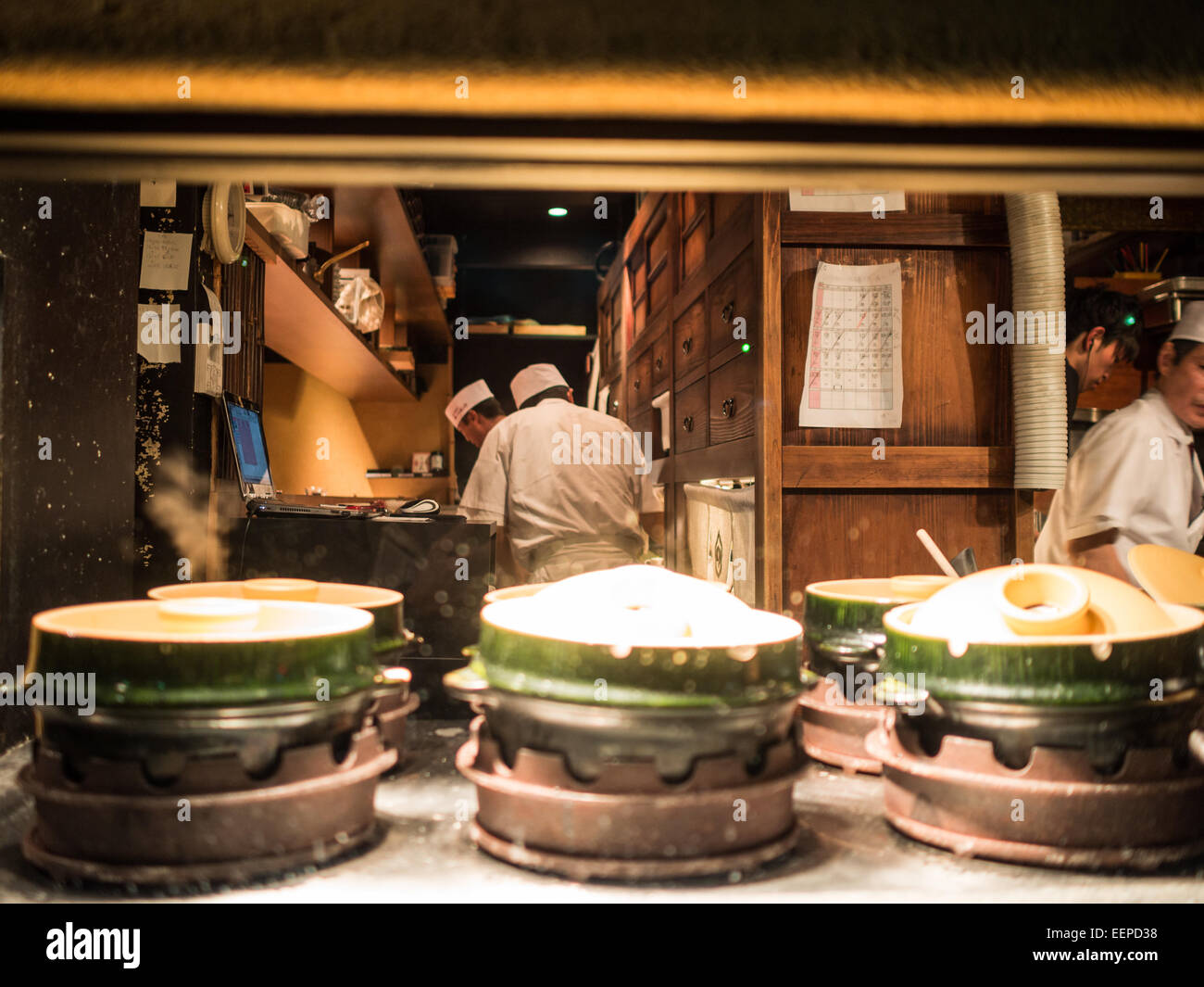 Looking inside a Kyoto restaurant kitchen from the street Stock Photo