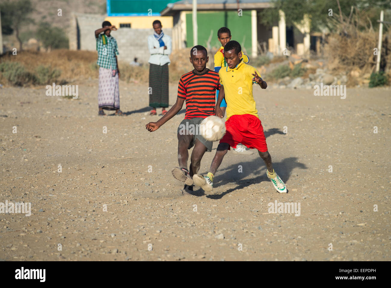 Children play football on a dirt pitch in Abala, Ethiopia, Africa Stock Photo