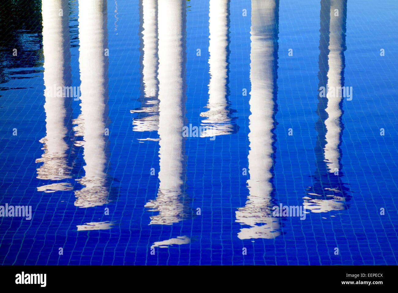 Reflection of white pillars in the water Stock Photo