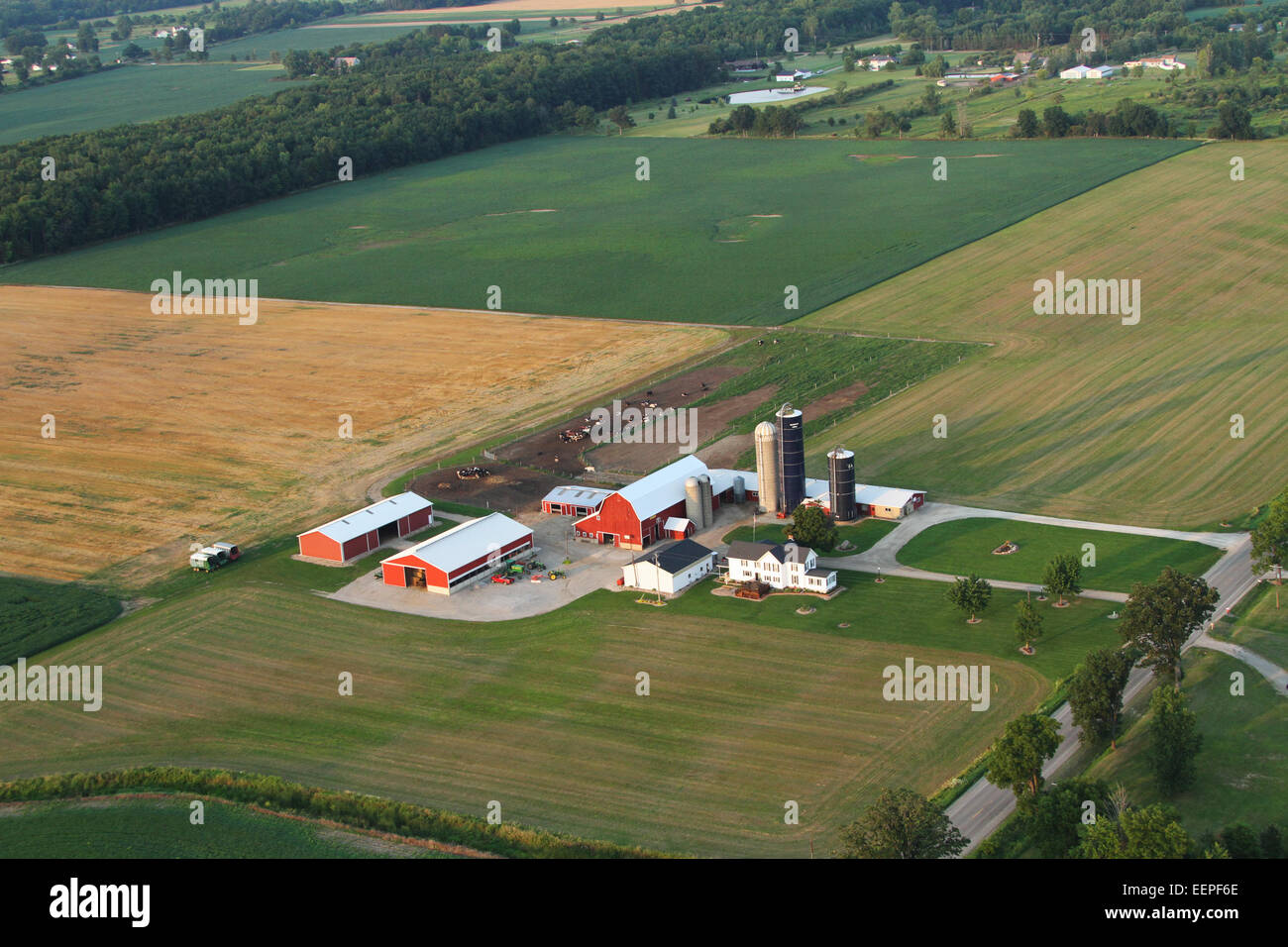 Aerial view of farm land and farm buildings. Purdy Field FlyIn. August