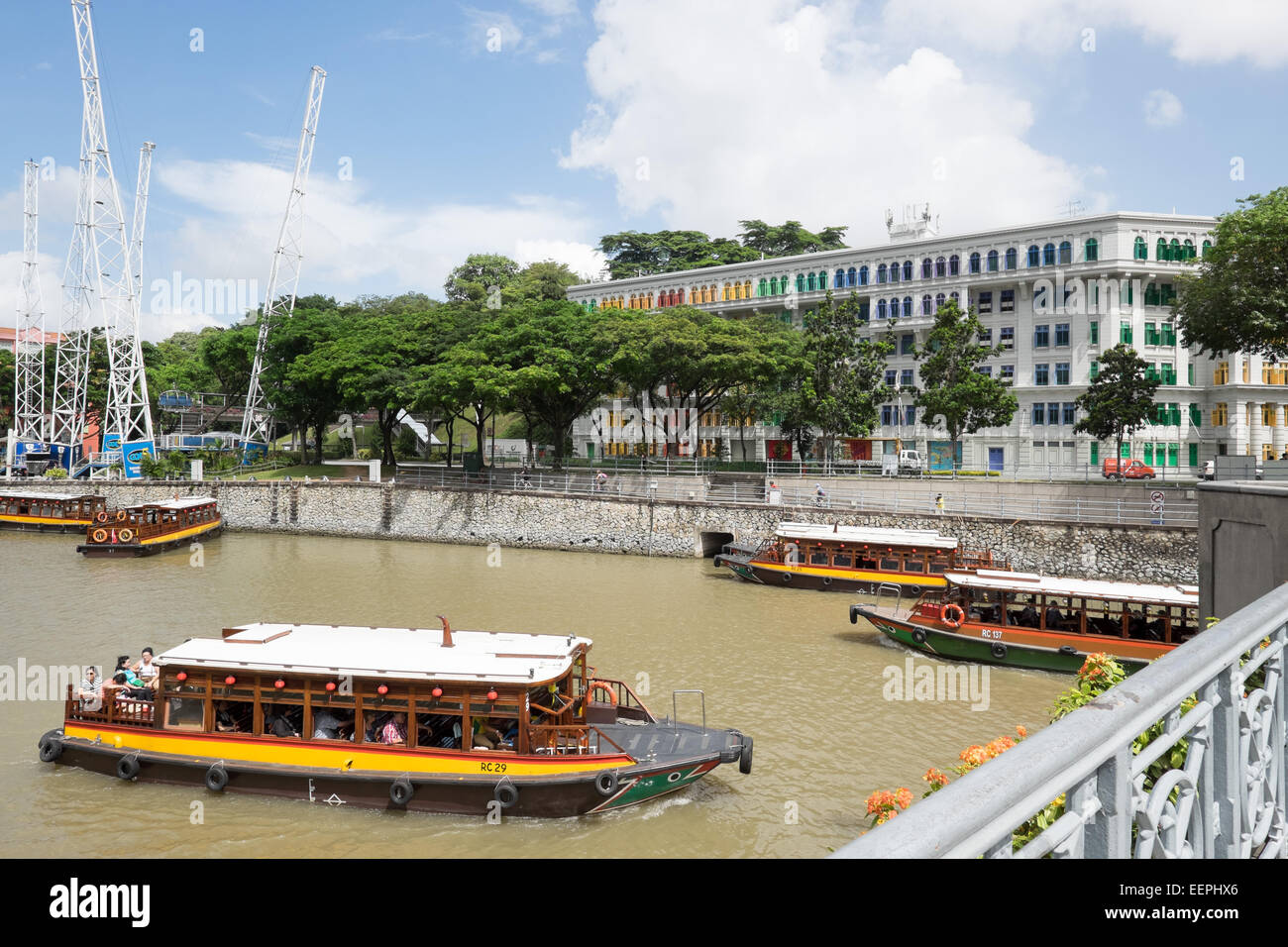 Tour boats on the Singapore River, Singapore River Walk. Old Hill Street Police Station in the background. Stock Photo