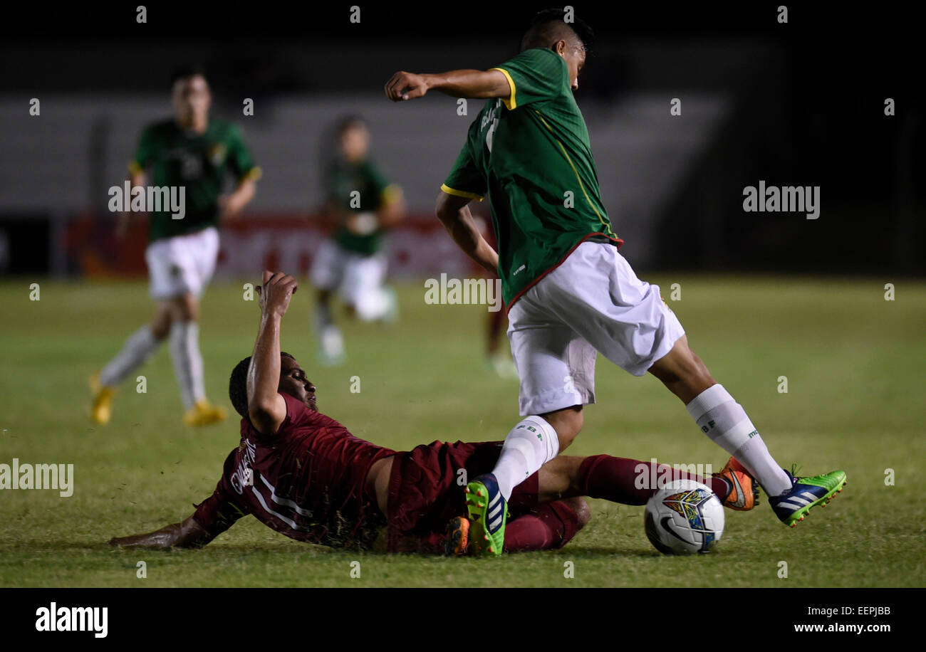 Colonia, Uruguay. 20th Jan, 2015. Joel Bejarano (R) of Bolivia vies with Jose Gonzales of Peru during a match at the South American U-20 tournament in Colonia, Uruguay, on Jan. 20, 2015. Credit:  Nicolas Celaya/Xinhua/Alamy Live News Stock Photo