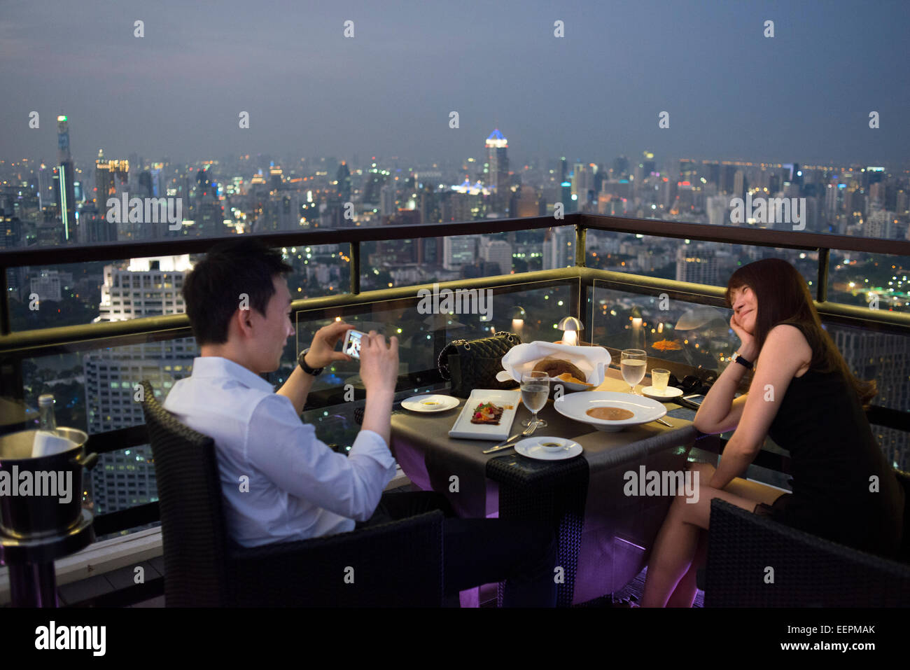 Romantic dinner. Banyan Tree Rooftop Vertigo & Moon Bar, Restaurant, , Bangkok , Thailand. View of the city, Vertigo Bar and Res Stock Photo