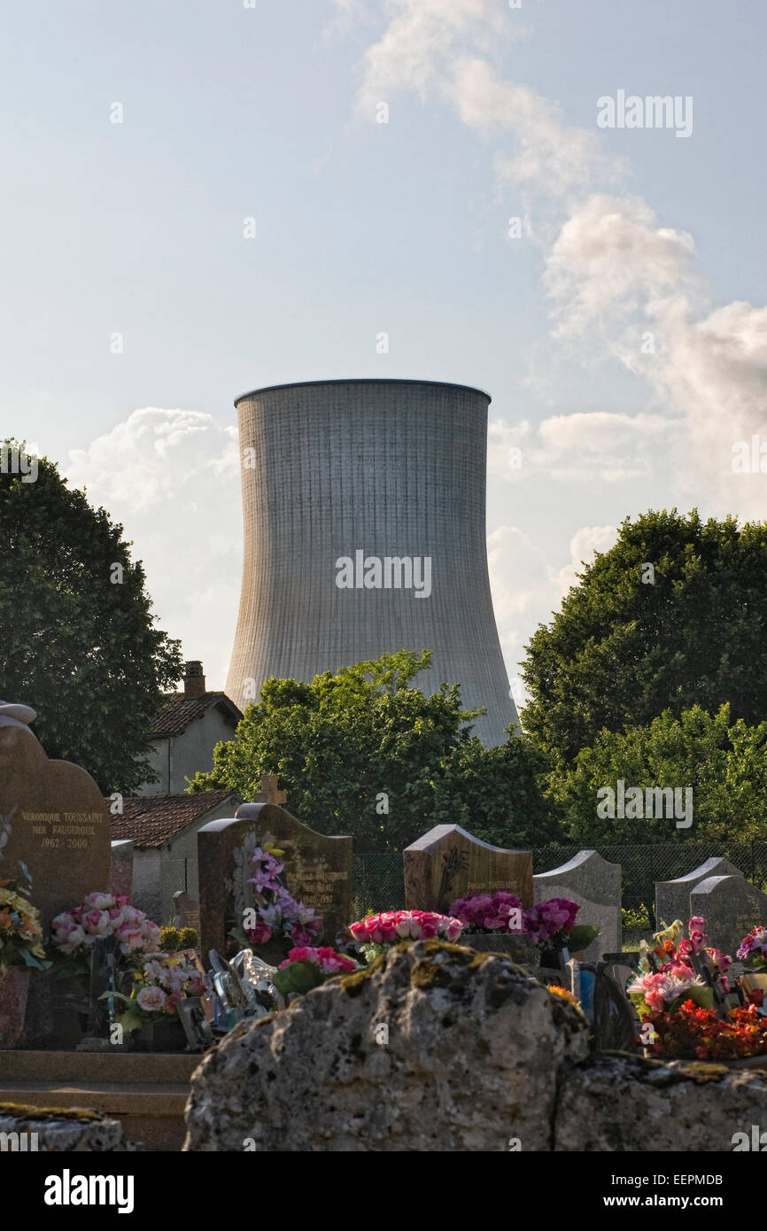 Cooling Tower of a Nuclear Power station overlooking the cemetery at Civaux. Stock Photo