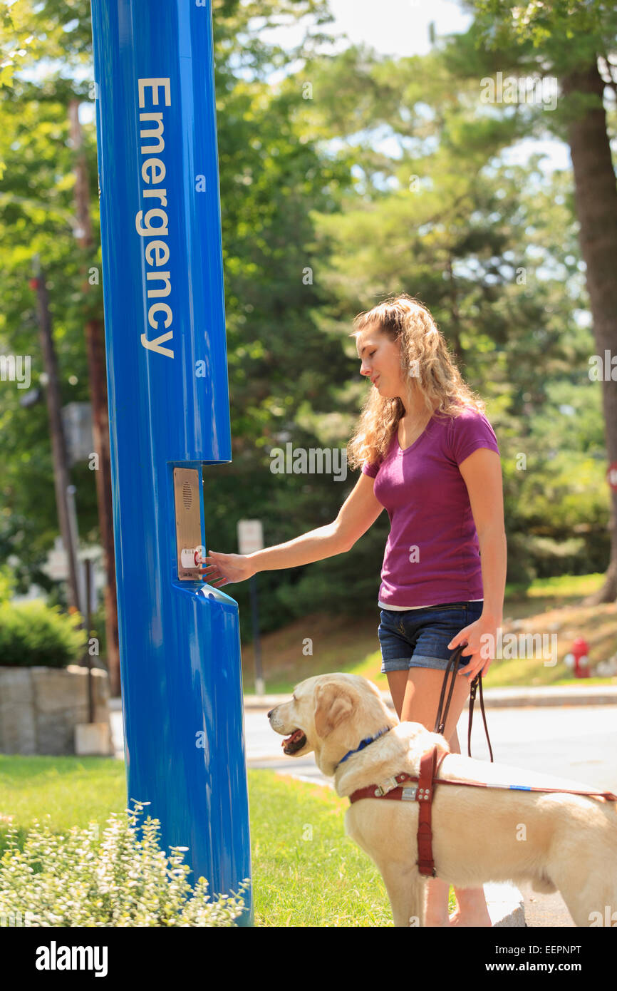 Student with visual impairment and her service dog using Emergency