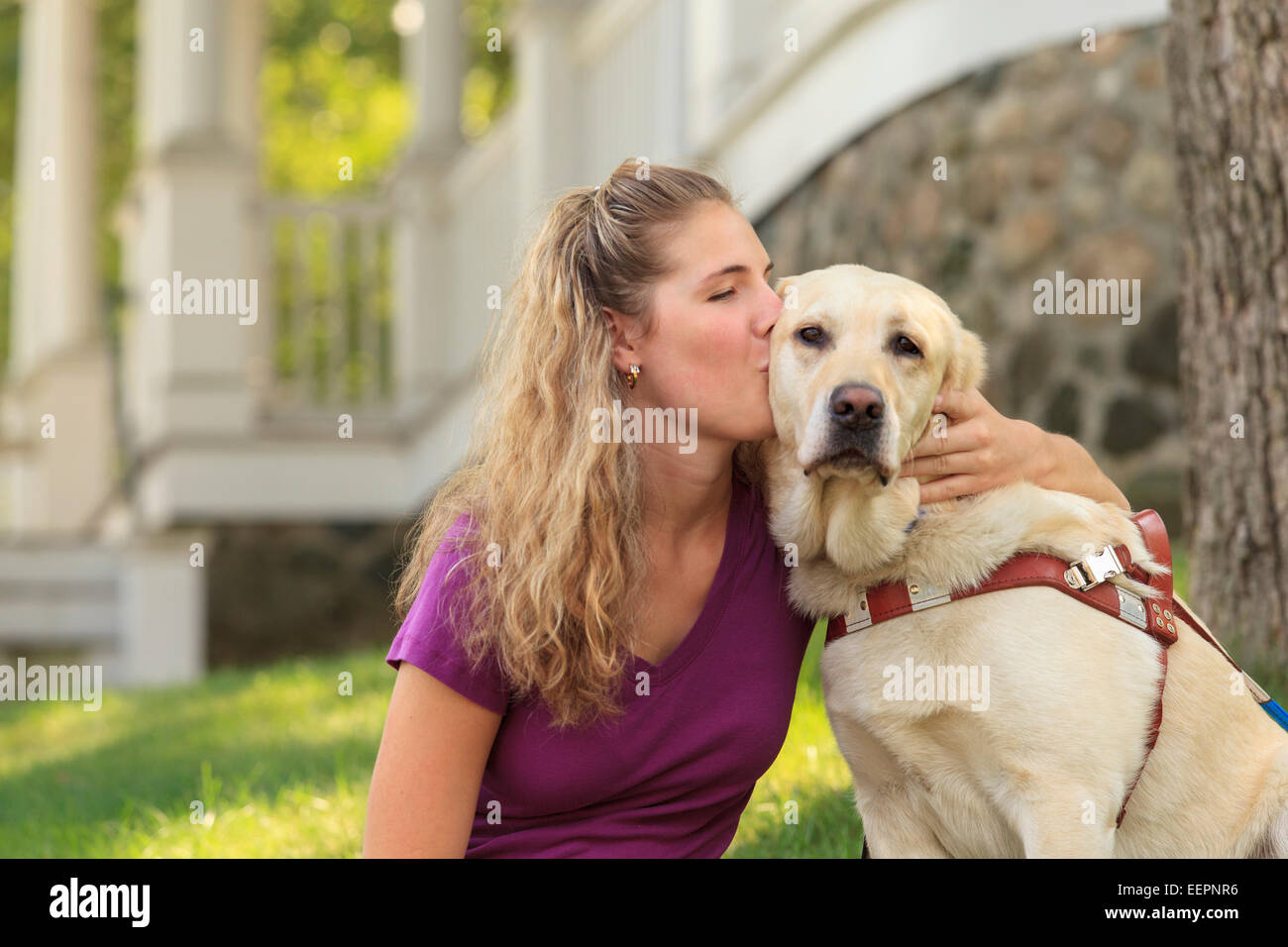 Woman with visual impairment kissing her service dog Stock Photo Alamy