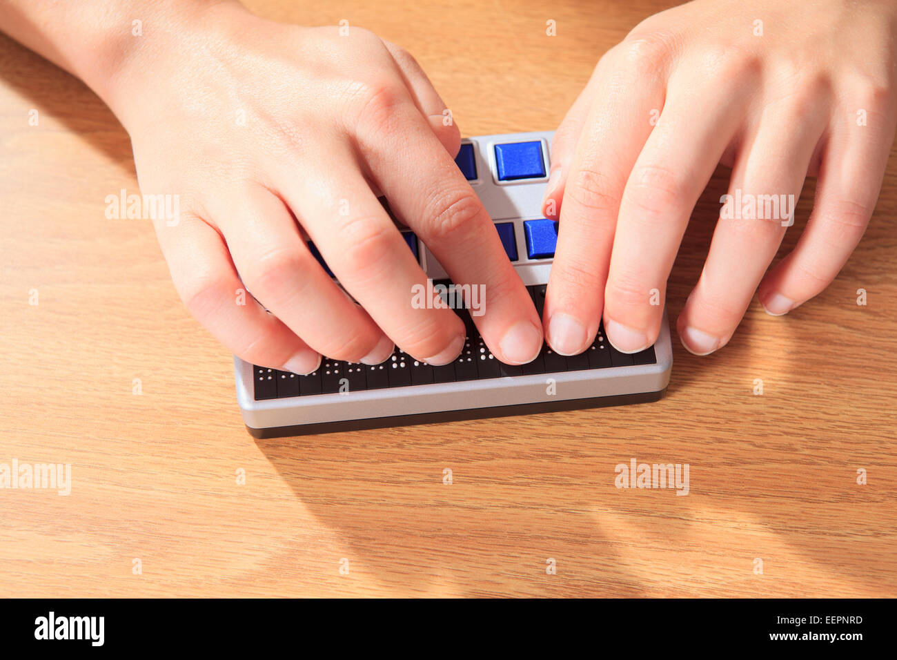 Student with visual impairment using her Braille display to communicate Stock Photo Alamy
