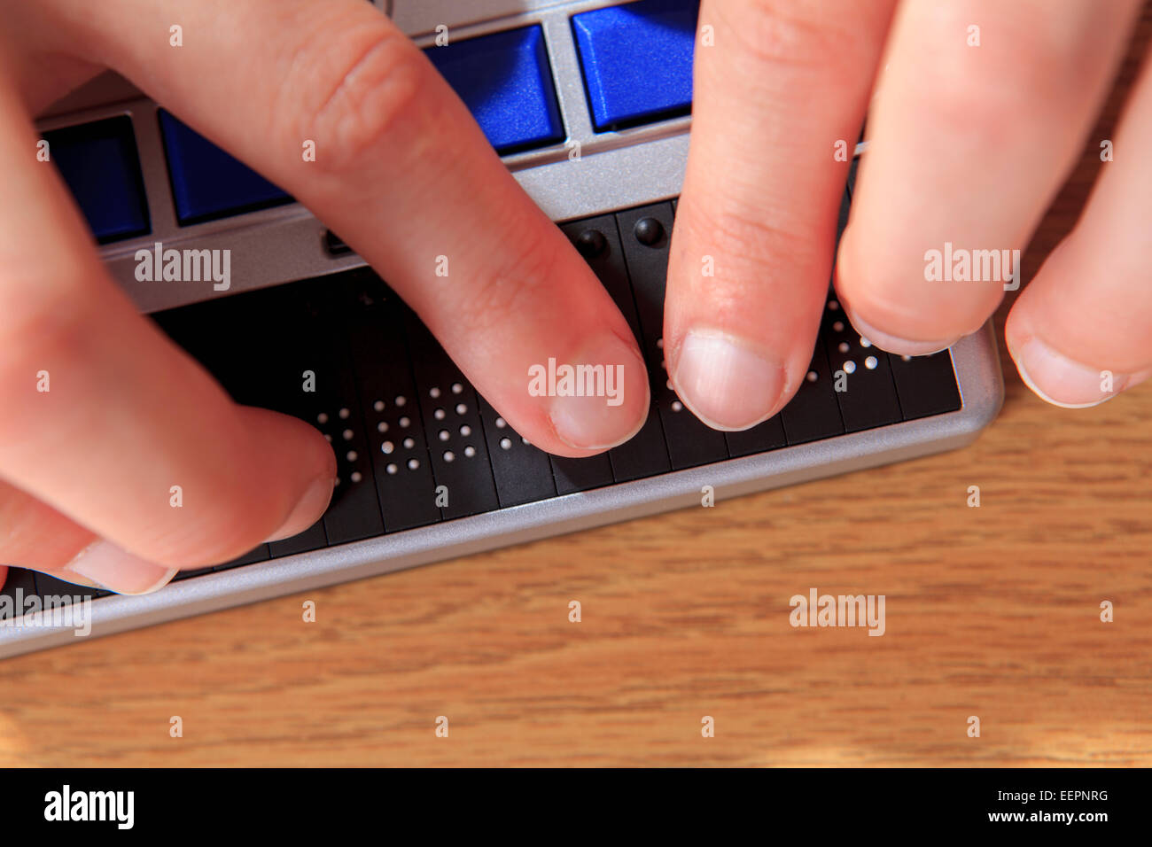 Student with visual impairment using her Braille display to communicate Stock Photo Alamy