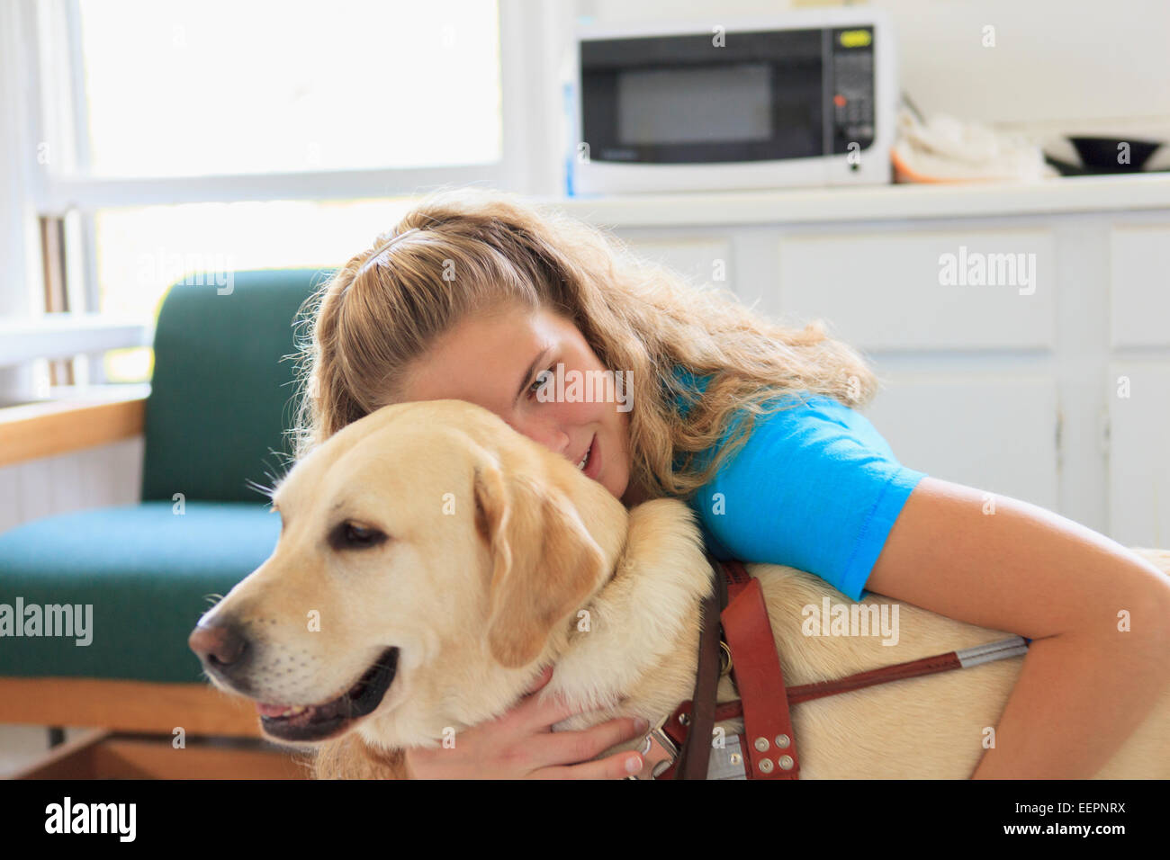 Woman with visual impairment hugging her service dog Stock Photo Alamy