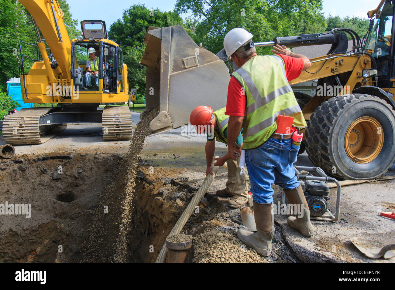 Filling gravel into an hires stock photography and images Alamy