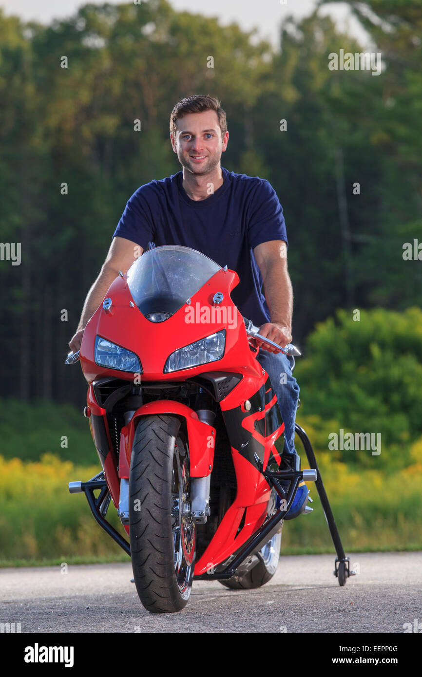 Man with spinal cord injury on his custom adaptive motorcycle Stock Photo