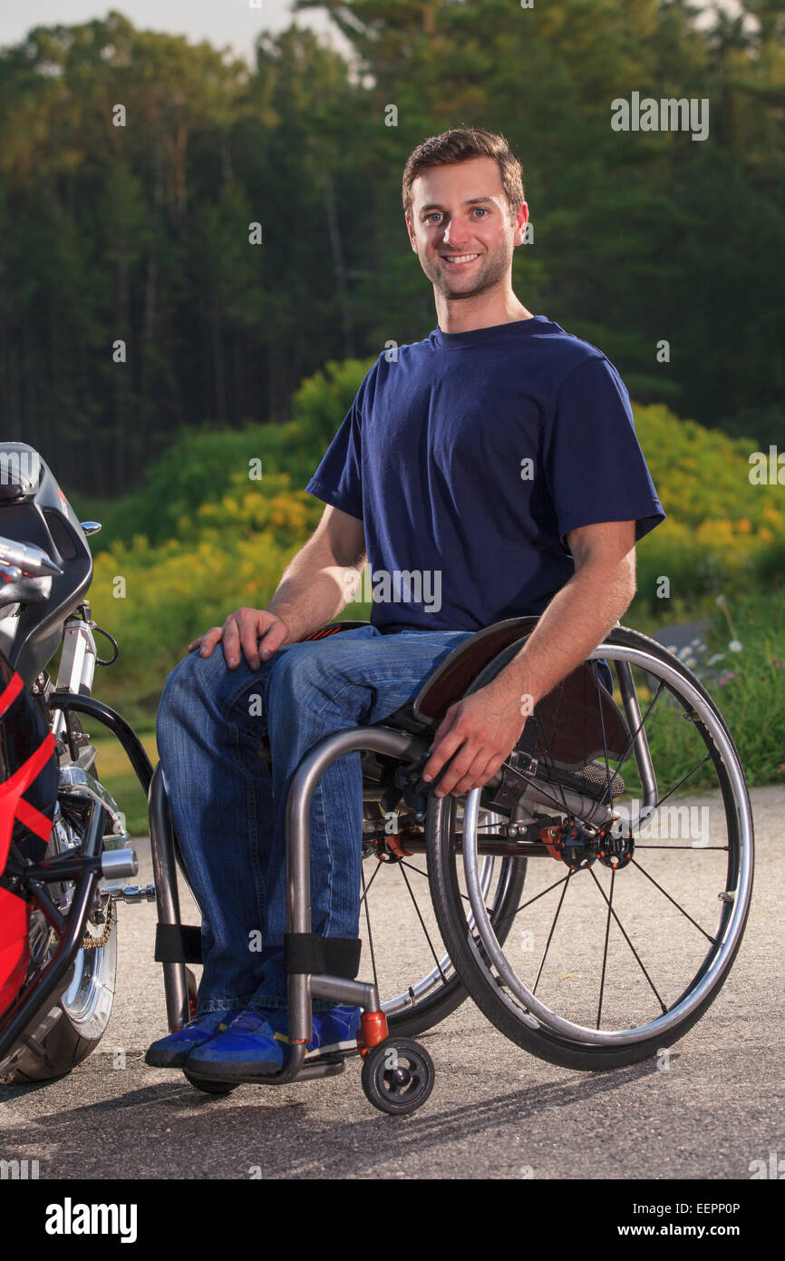 Man with spinal cord injury with his custom adaptive motorcycle Stock Photo