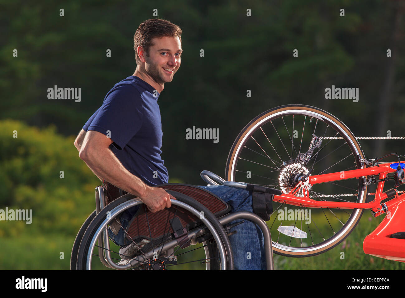 Man with spinal cord injury in his wheelchair with his custom adaptive hand cycle Stock Photo