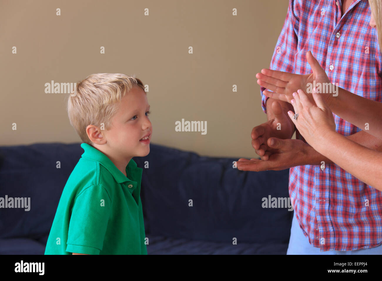 Parents and son with hearing impairments signing 'stop, timeout' in American sign language Stock Photo