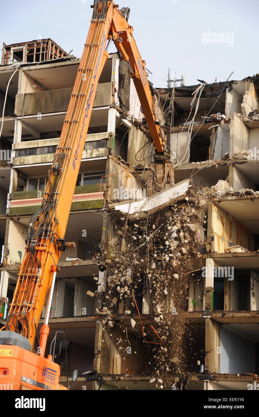 Debris falls from an upper storey as an apartment block is turned ...