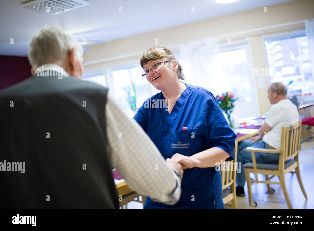 Nursing home, staff with elderly, happiness Stock Photo