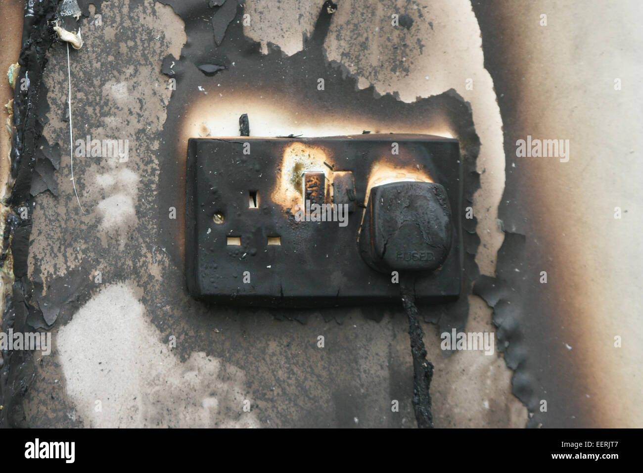 house fire, electrical socket overload Stock Photo Alamy
