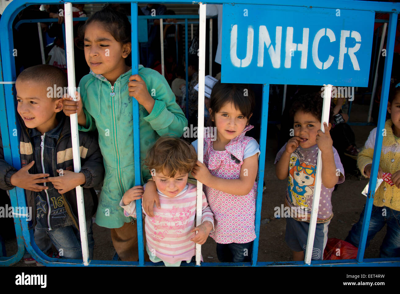 Syrian refugee children waiting to register at UNHCR Lebanon transit camp Stock Photo