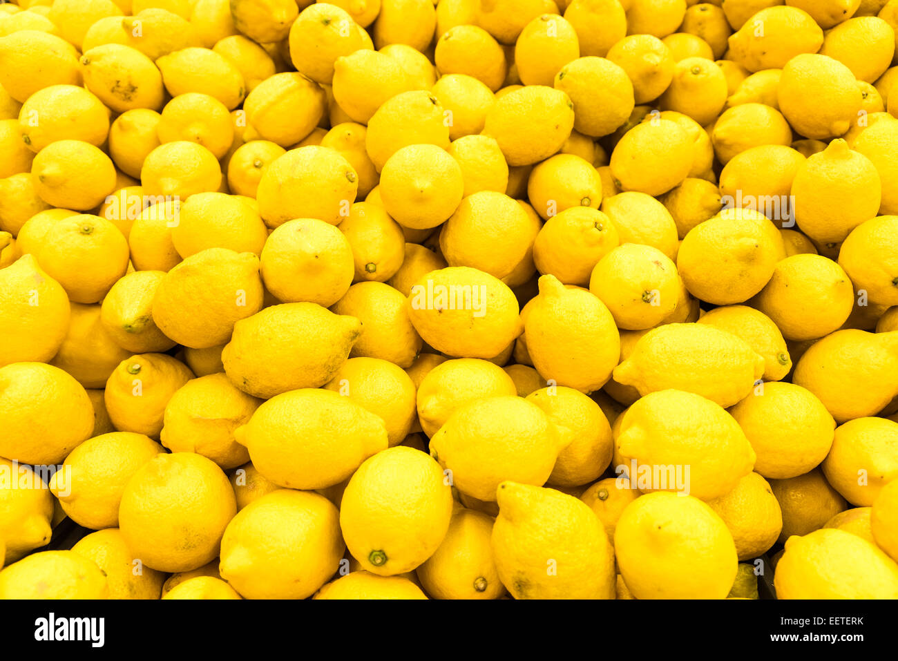Colorful Display Of Lemons In Fruit Market Stock Photo