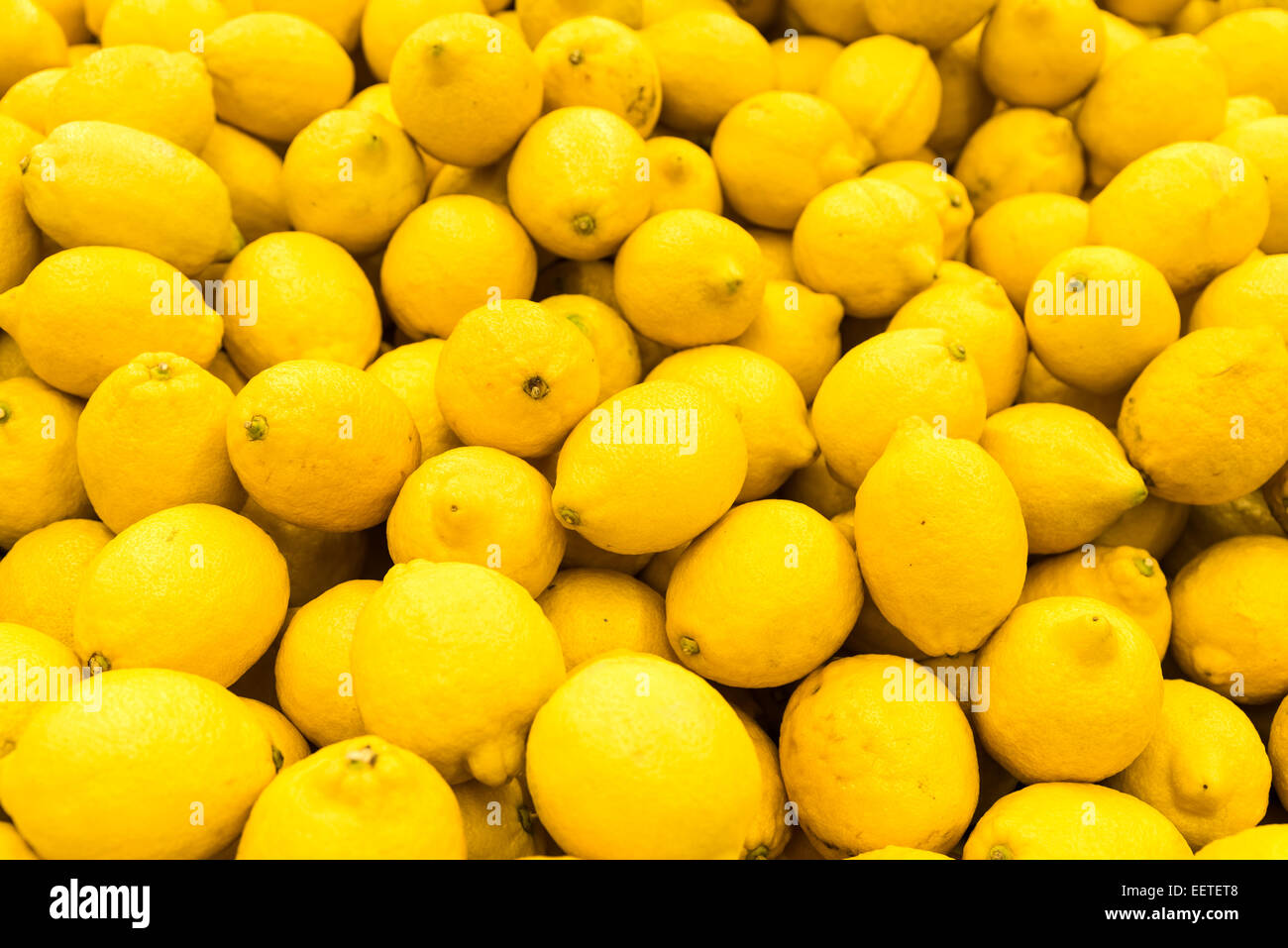 Colorful Display Of Lemons In Fruit Market Stock Photo