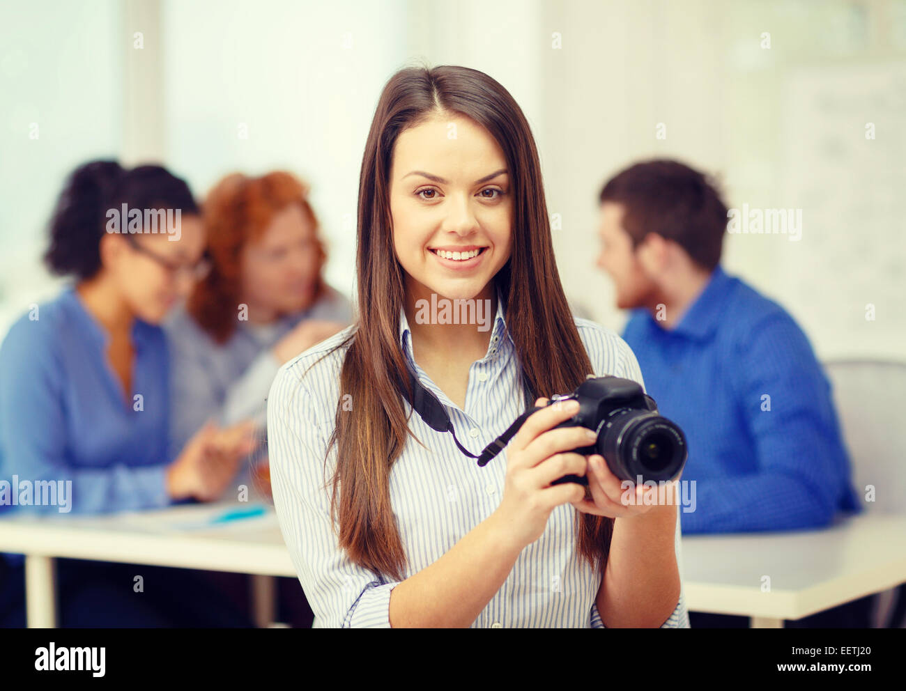 smiling female photographer with photocamera Stock Photo - Alamy