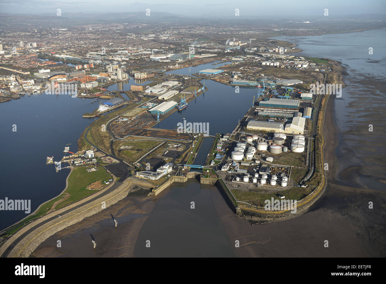 An aerial view of Cardiff Docks on a fine day with the city visible behind Stock Photo