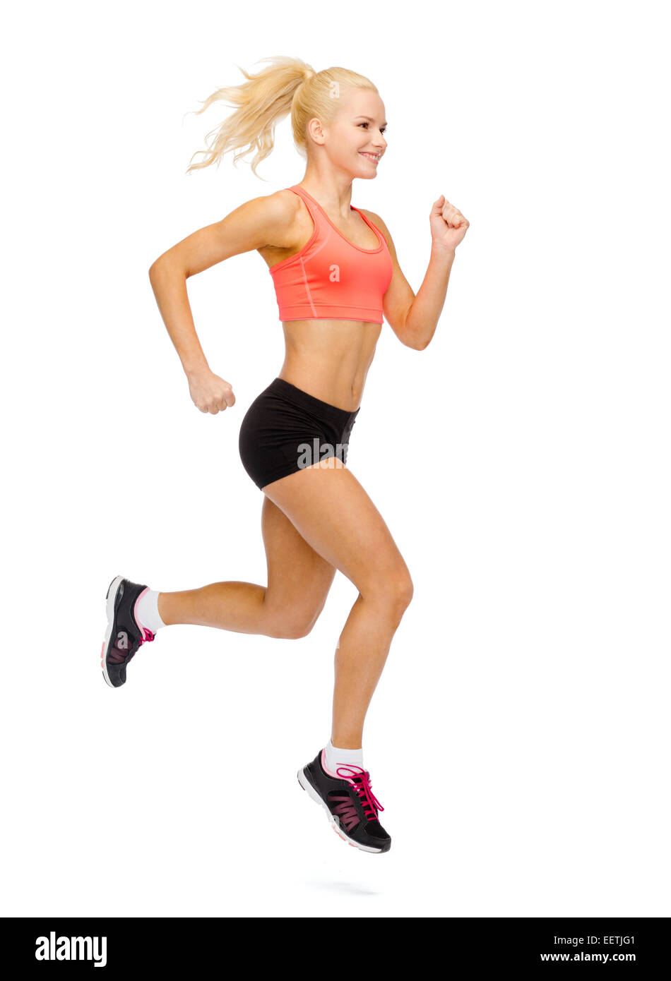 sporty woman running or jumping Stock Photo