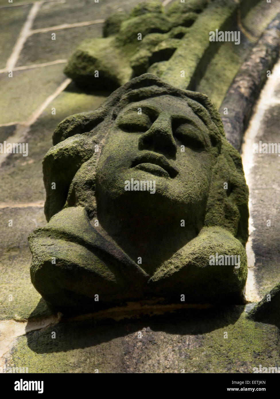 Stone carving on the side of a St. Thomas the Apostle church window in the historic village of Heptonstall in Yorkshire Stock Photo