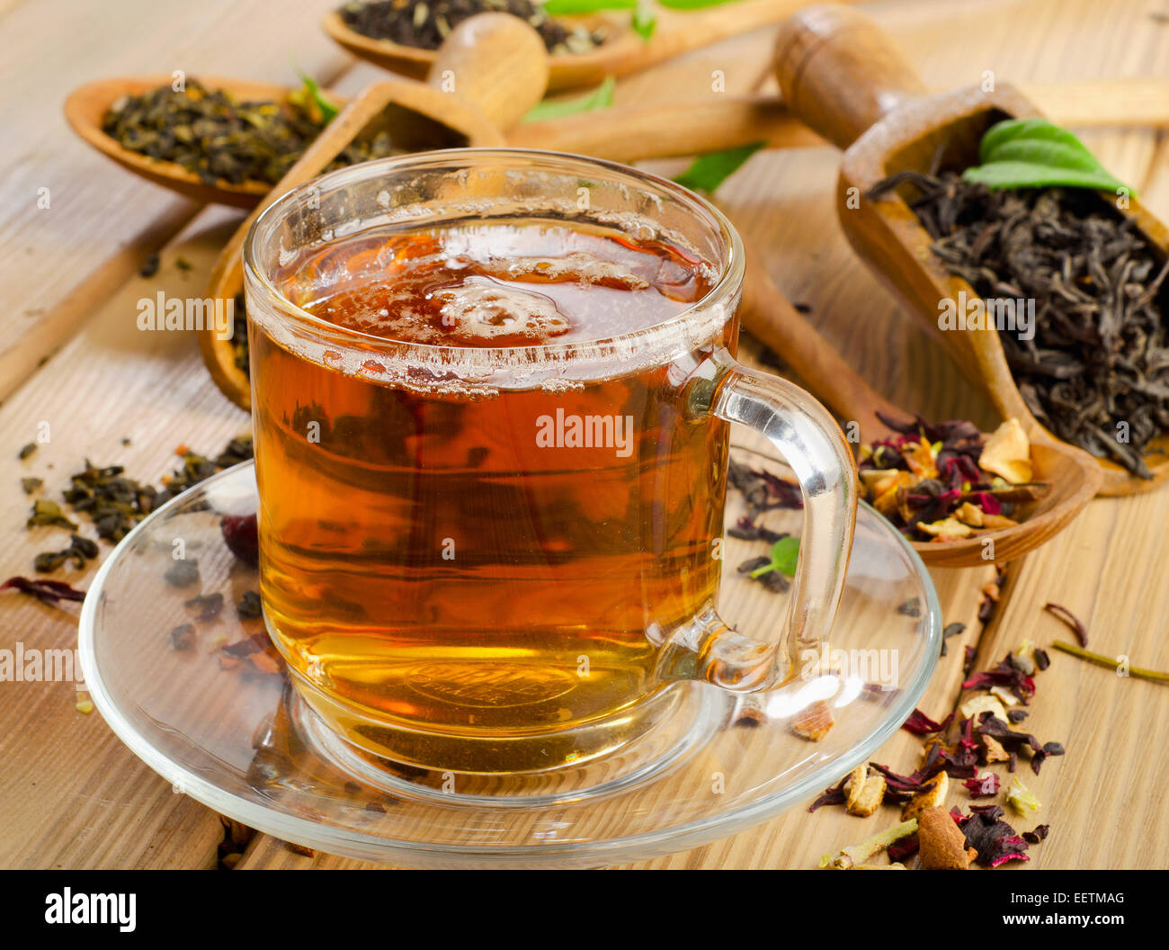 Cup of tea and assortment of dry tea in spoon . Selective focus Stock ...