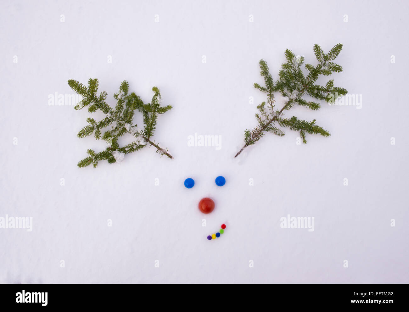 Rudolf the red nose reindeer face in the snow Stock Photo