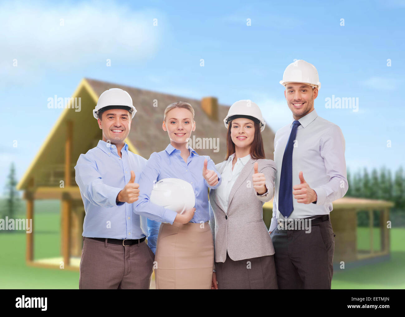 happy business team in office showing thumbs up Stock Photo - Alamy