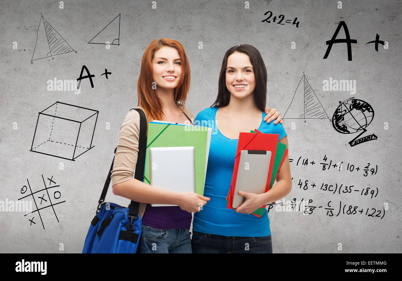 two smiling students with bag, folders and tablet Stock Photo - Alamy