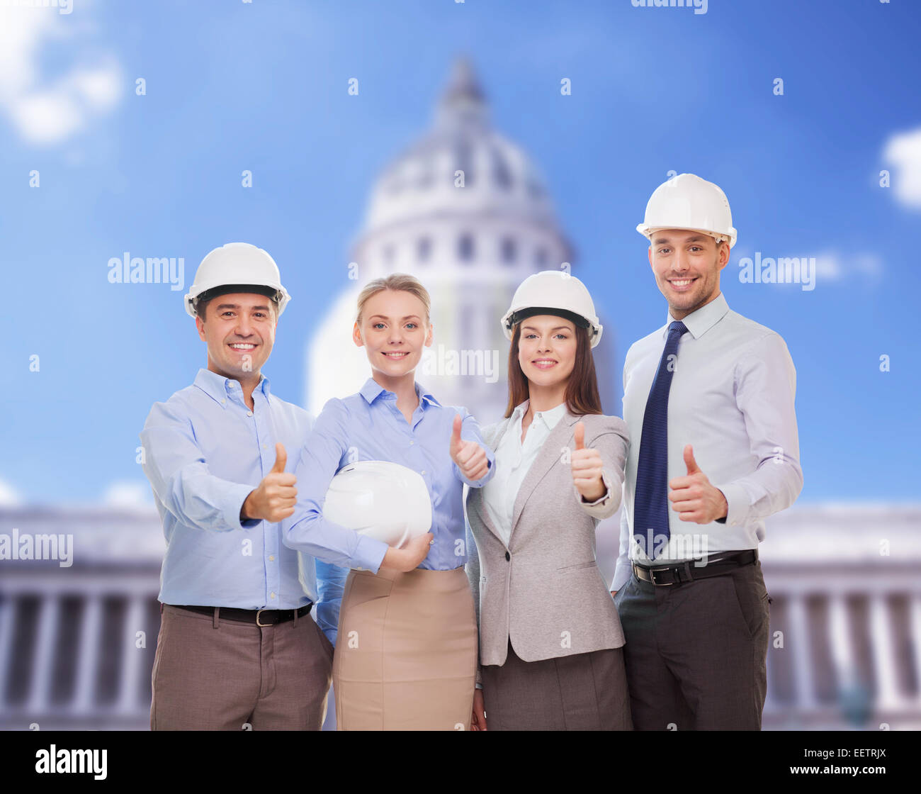 happy business team in office showing thumbs up Stock Photo - Alamy