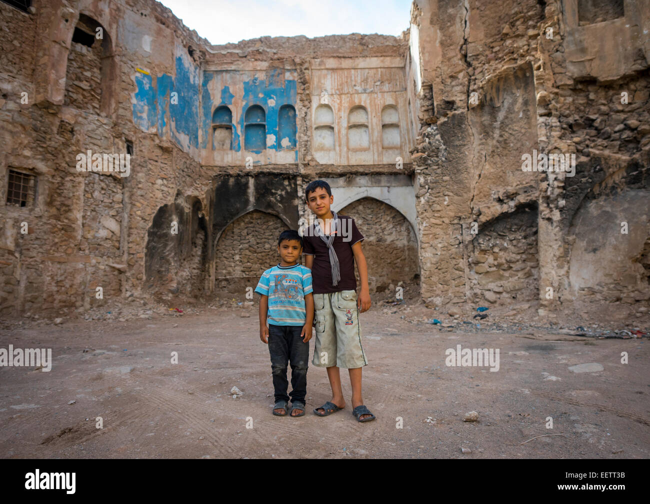 Kurdish Children In Front Of An Abandoned House, Koya, Kurdistan, Iraq Stock Photo