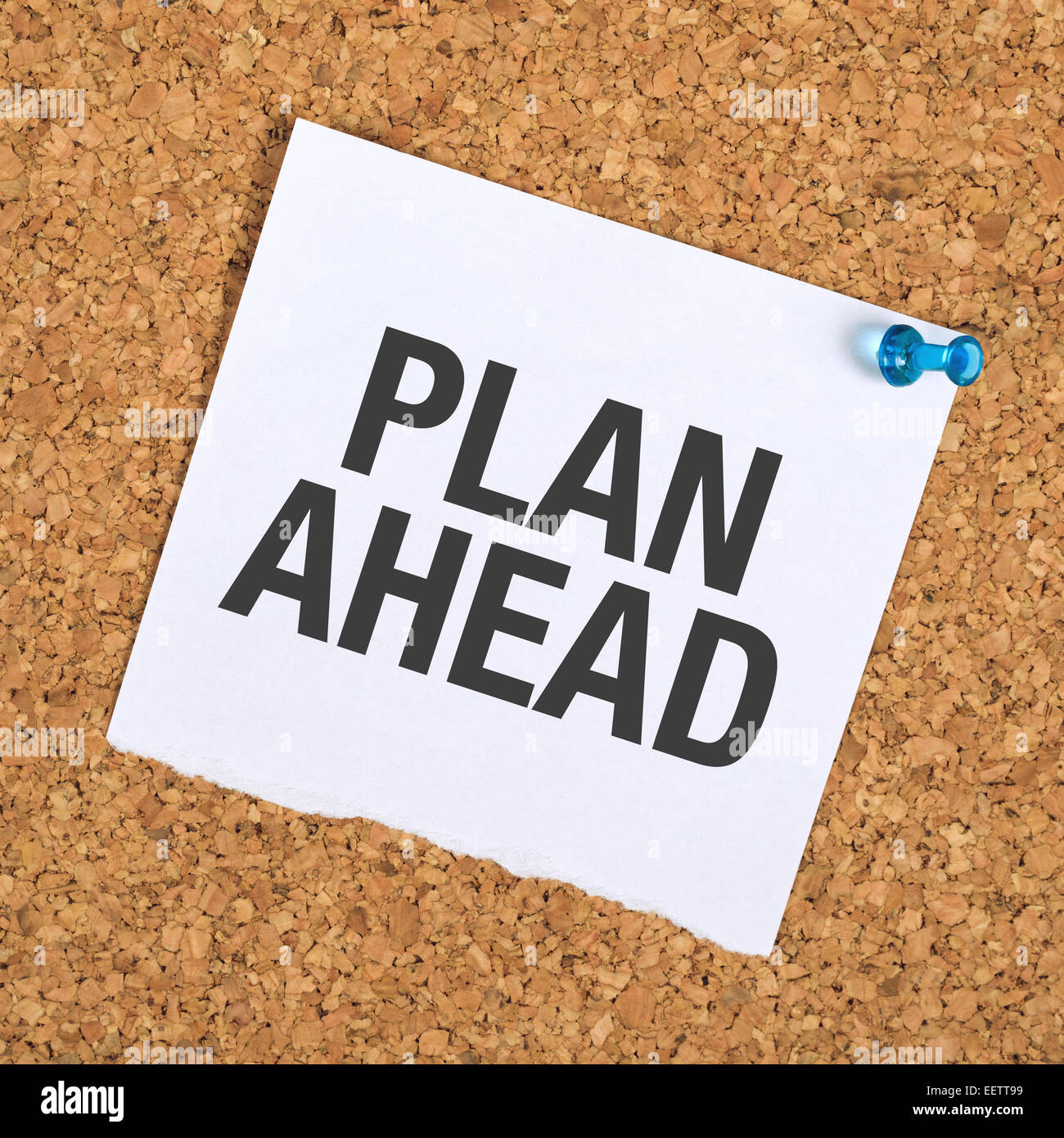 Plan Ahead Reminder Note Pinned to a Cork Memory Bulletin Board in