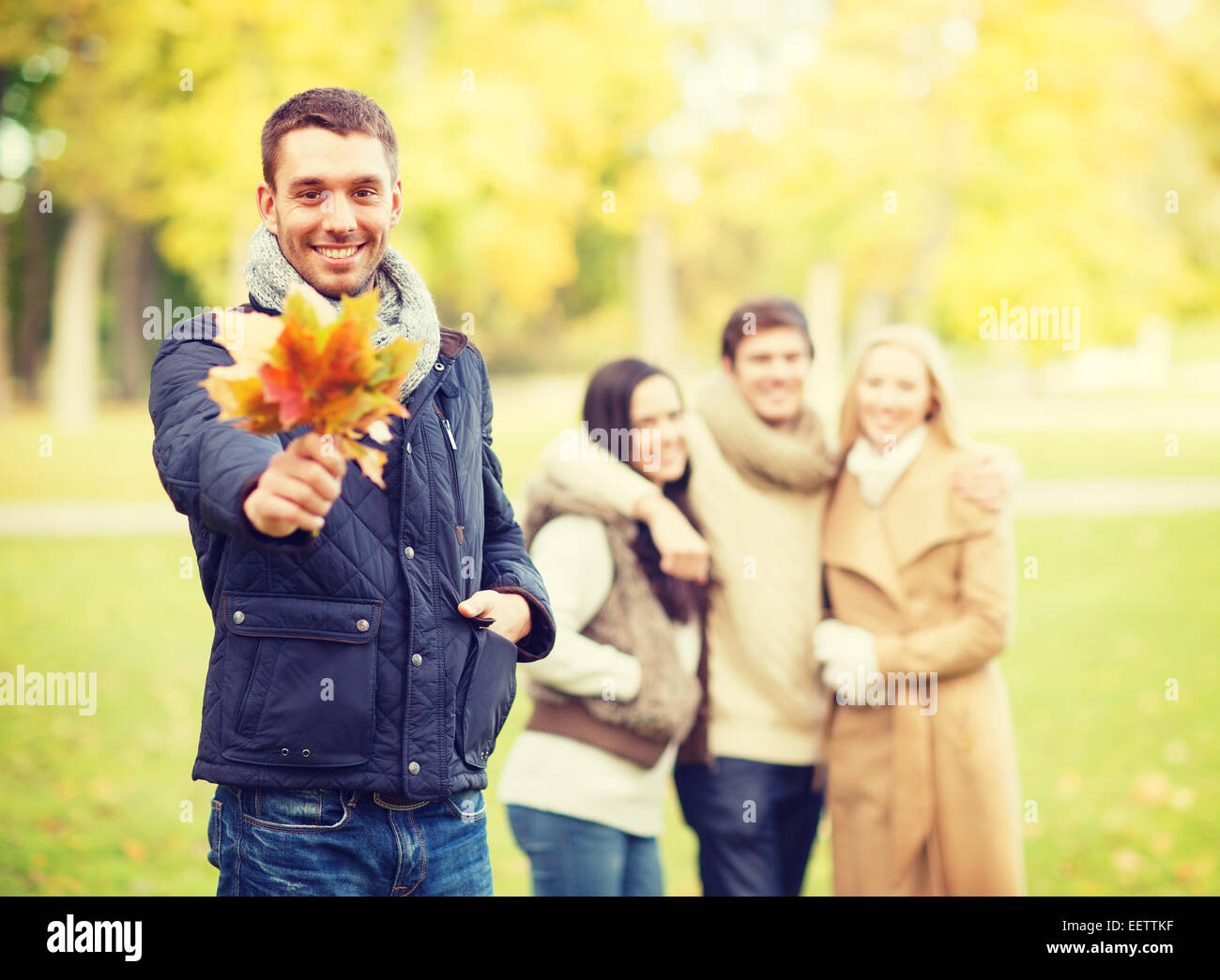 group of friends having fun in autumn park Stock Photo - Alamy