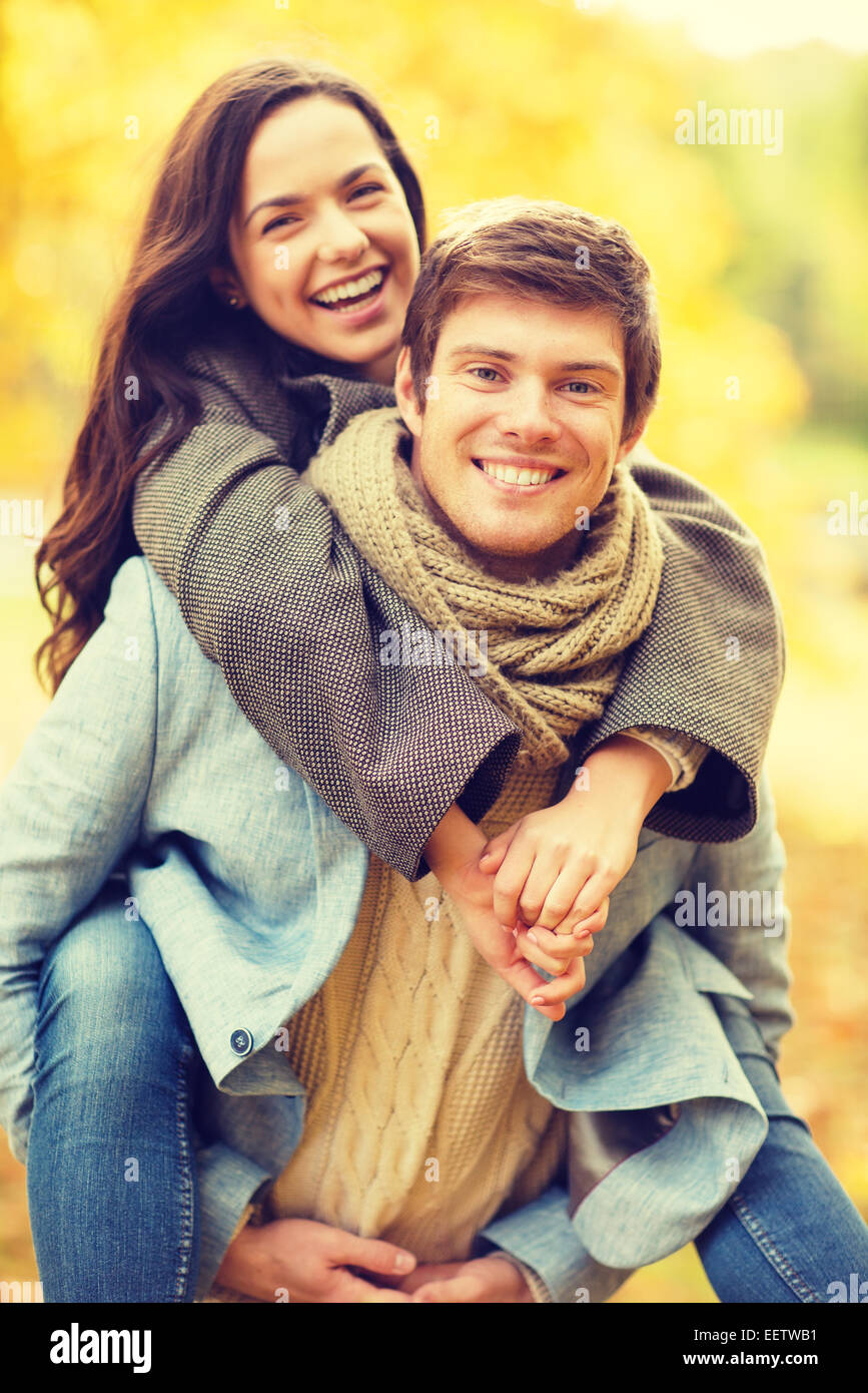 romantic couple playing in the autumn park Stock Photo - Alamy