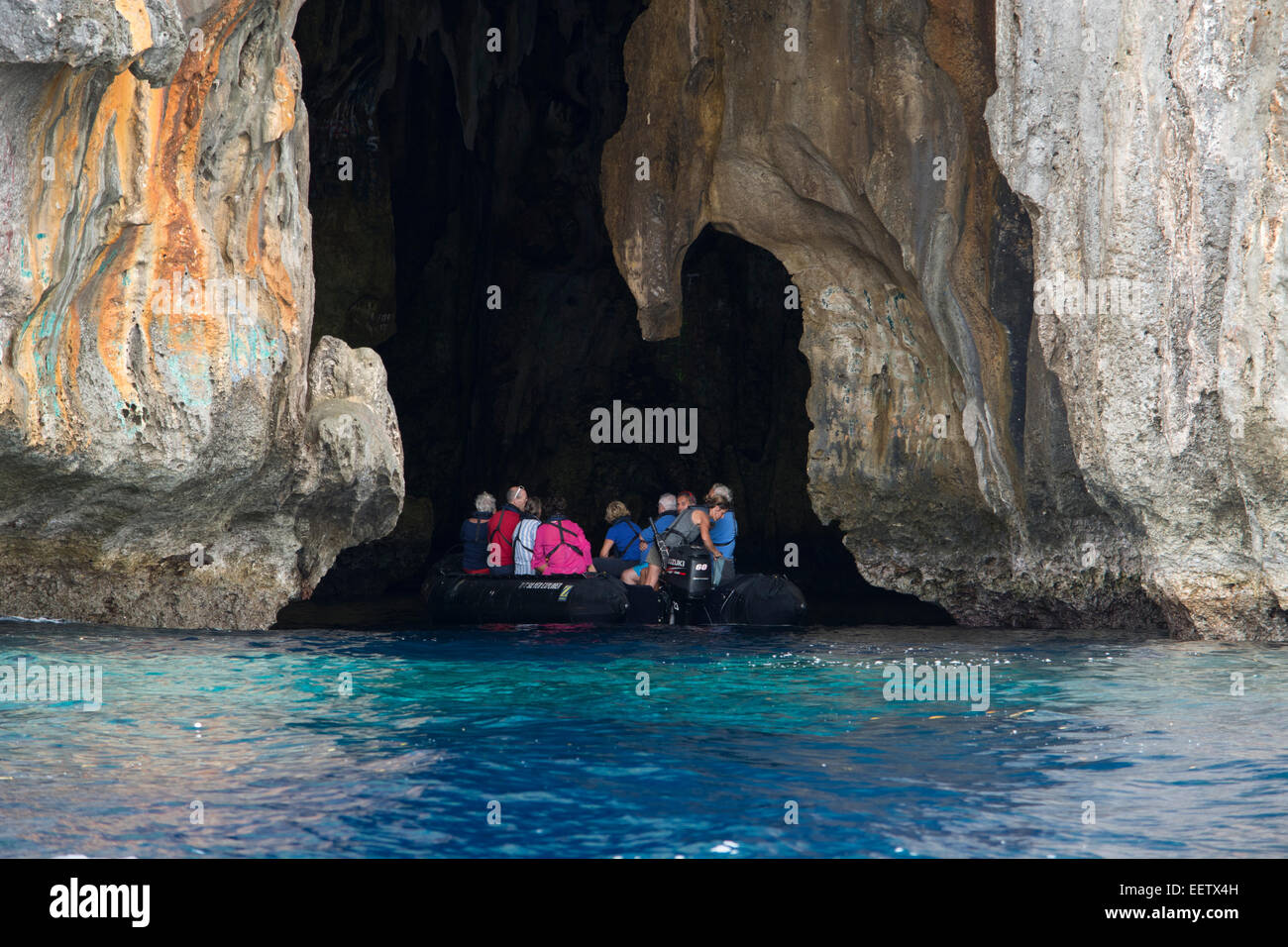 Kingdom of Tonga, Vava'u Islands, Swallow's Cave near Neiafu. Tourists in zodiac exploring cave. Stock Photo