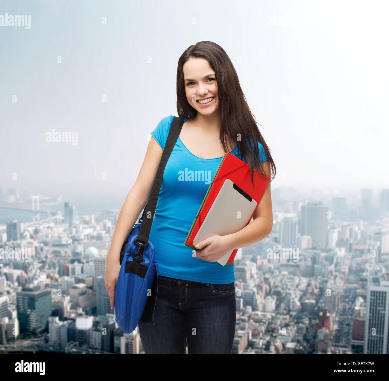 smiling student with bag, folders and tablet pc Stock Photo - Alamy