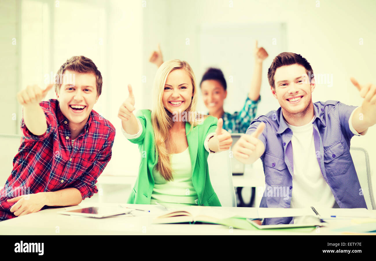 students showing thumbs up at school Stock Photo - Alamy