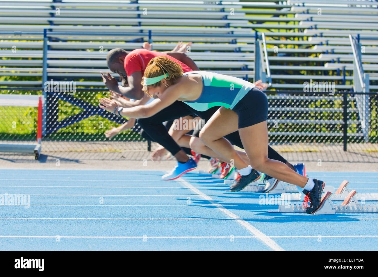 Runners on a track at start line Stock Photo Alamy