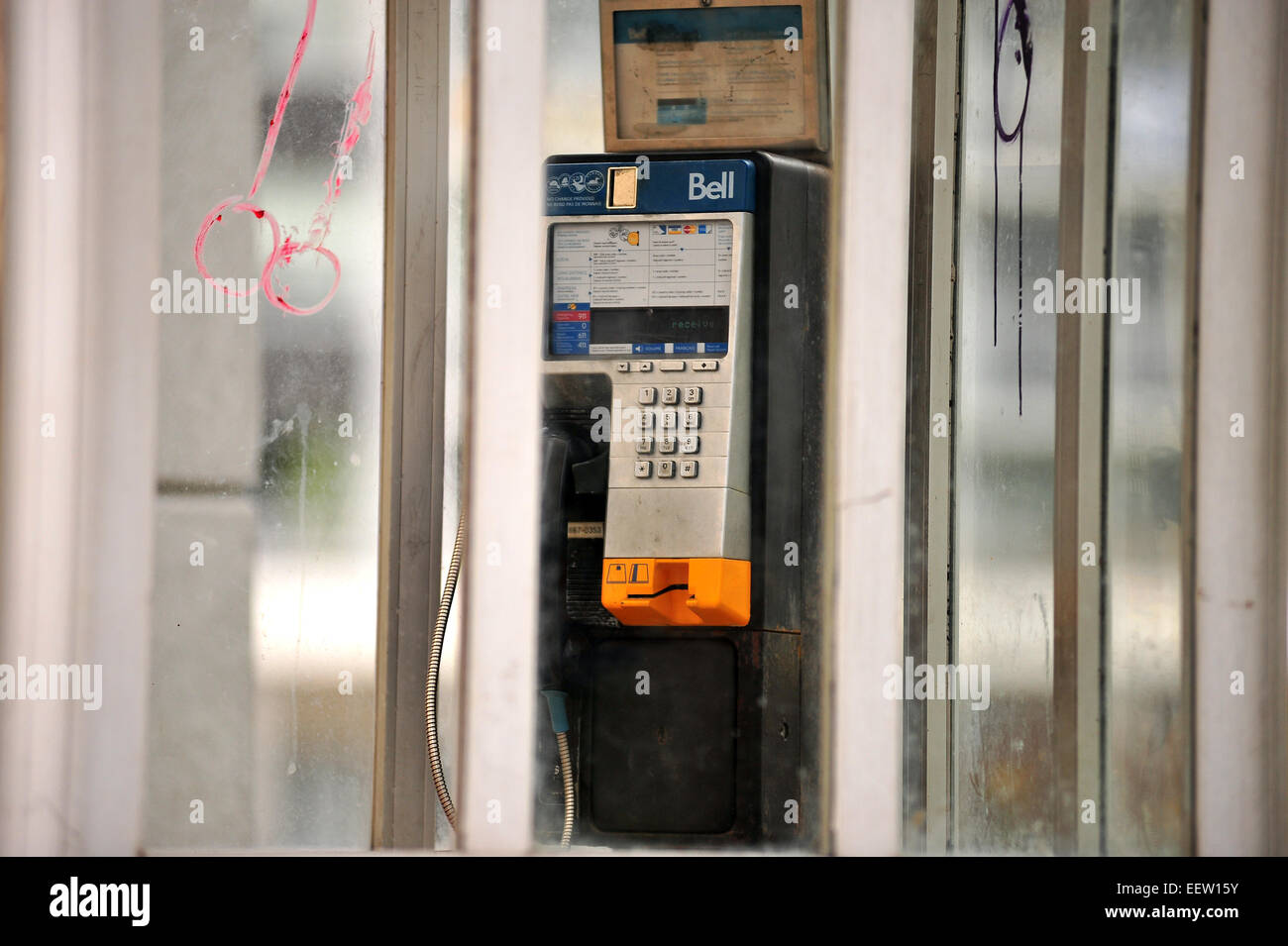 A vandalised Bell public telephone box in London, Ontario, Canada. Stock Photo
