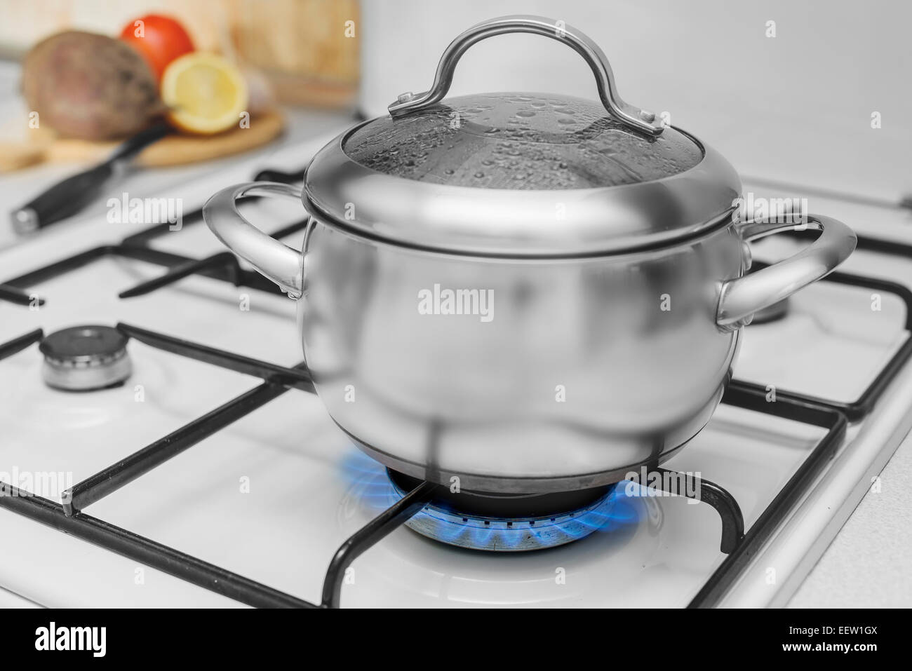 Brass grill pan placed on the gas stove 6929378 Stock Photo at Vecteezy