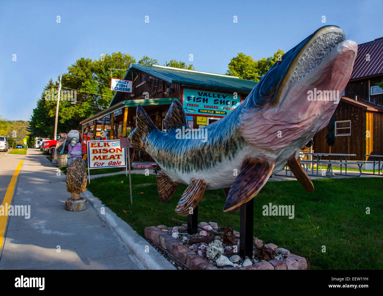 A large muskie statue stands in front of the Valley Fish and Cheese Shop in Prairie du Chien, Wisconsin  on the Mississippi Rive Stock Photo
