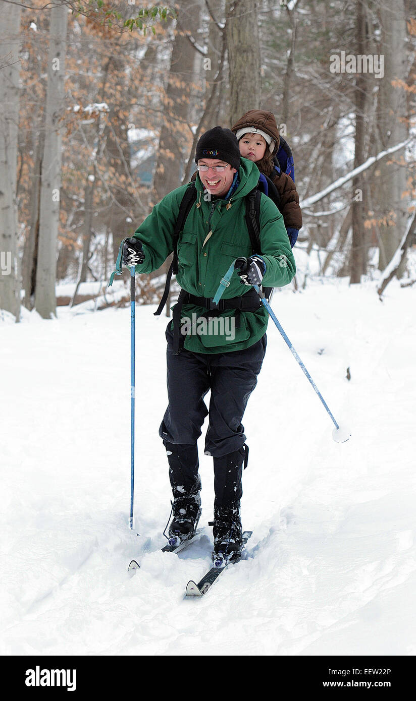 New Haven--Chuck Sindelar enjoys some time with his daughter, Maia (age-2), as they cross-country ski in the woods near Conrad Drive in New Haven. They are from New Haven.   01/22/12 Stock Photo