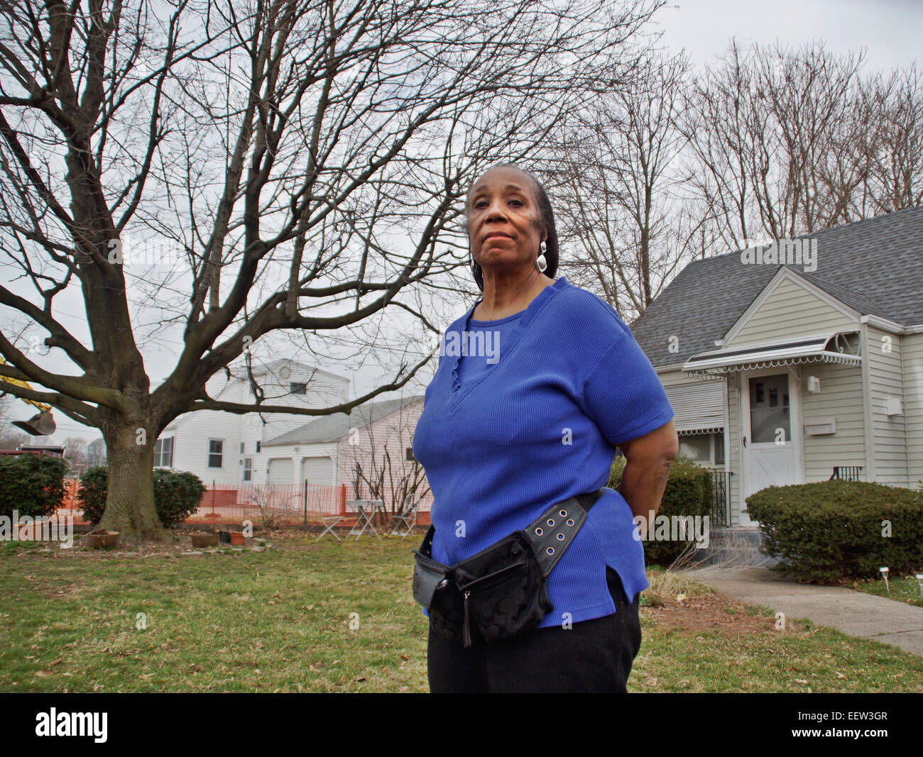 Hamden CT USA- Priscilla Taylor, the home owner at 131 Bryden Terrace in Hamden, will not take part in the federal ground remediations going on in her neighborhood because she doesn't want her trees cut down. Stock Photo