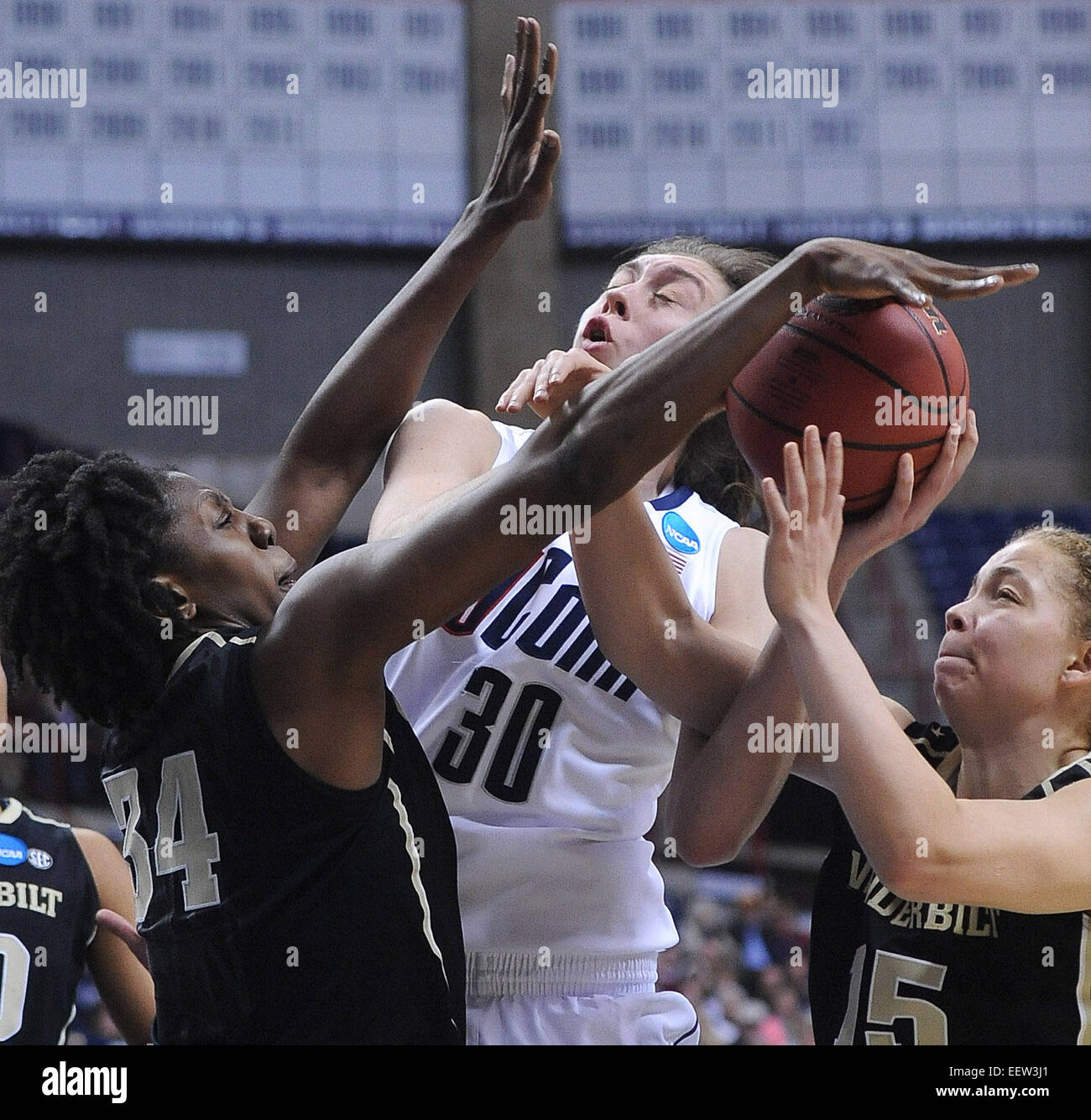 Storrs-- NCAA Division I Women's Basketball Championship. UCONN's Breanna Stewart takes the hard foul from Vanderbilt's Jasmine Jenkins, right, and Tiffany Clark during the second half.  Photo-Peter Casolino/Register pcasolino@newhavenregister.com Stock Photo